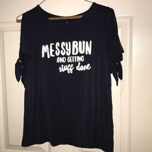 T-shirt says “Messy Bun Getting Stuff Done”